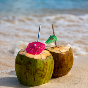 coconuts decorated with small paper umbrella ornaments