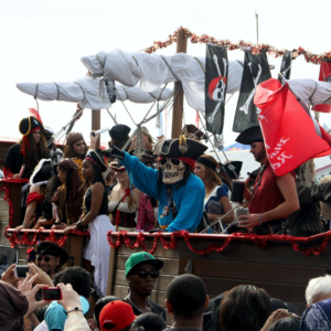 a parade float in Grand Cayman, filled with people dressed as pirates