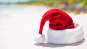 santa hat in the sand on the beach