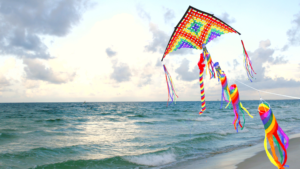 colourful kite flying over the ocean