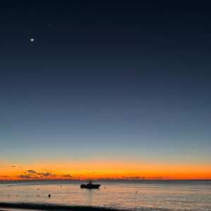 sunset on seven mile beach in grand cayman