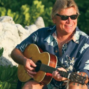 The Barefoot Man performing Caribbean and Caymanian folk music on guitar in the Cayman Islands